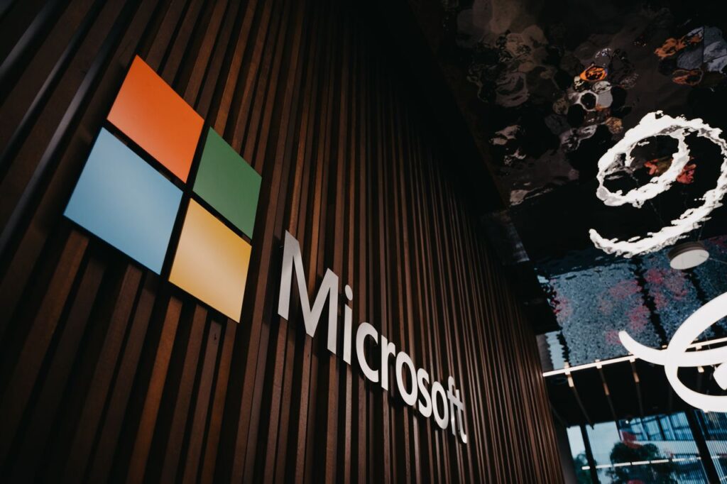 Szolgáltatások Interior view of Microsoft office with logo on wooden wall in Brussels, Belgium.